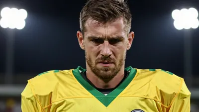 A 30-year-old male football player, wearing a yellow and green jersey, looking frustrated, with a shallow depth of field