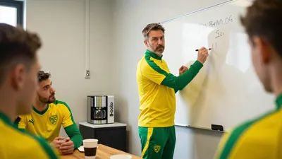 A 35-year-old Norwich City coach, wearing a yellow and green tracksuit, stands in front of a whiteboard, marker in hand...