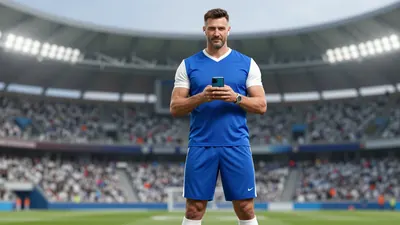 A 45-year-old, tall, athletic man with a strong jawline and short, dark hair, wearing a blue jersey with white sleeves...